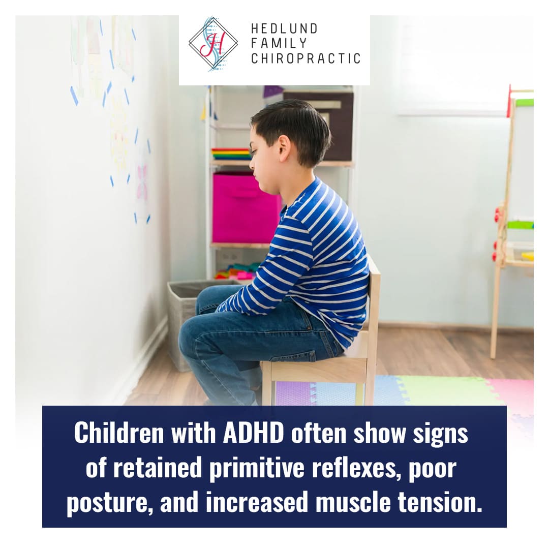 A young boy sits on a small chair in what appears to be a classroom or play area, looking down, with text stating that children with ADHD often show signs of retained primitive reflexes, poor posture, and increased muscle tension.